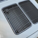 Twin engine lid grille, a feature of the T6 body