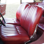 The red leather seats are in excellent condition and are very comfortable.