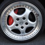 Red-painted Brembo brake calipers and Speedline 3pcs 18-inch wheels