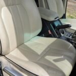 The interior is also in good condition, including the leather seats, but there are some scuffs from use on the right side of the driver's seat from the support down.