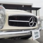 The vertical headlights, large chrome grille and large three-pointed star on the nose panel are reminiscent of the 300SL roadster of the past.