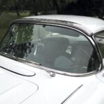 The beautifully sculpted window shield with curved surfaces like an aircraft canopy