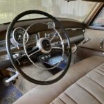 Bakelite steering wheel... aluminum horn button... great modeling.
